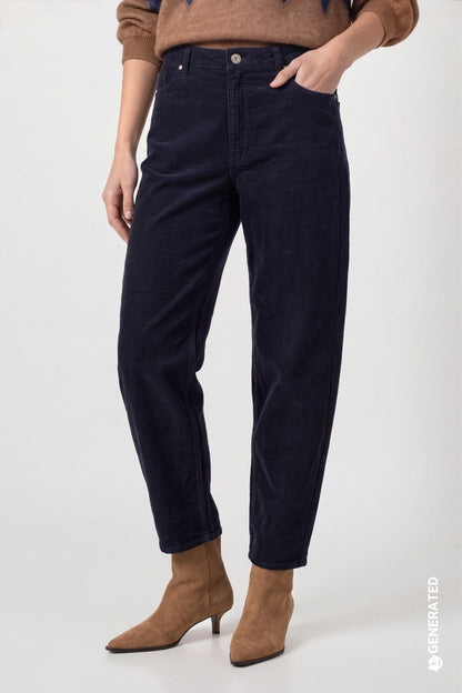 A model wearing dark navy blue barel corduroy trousers