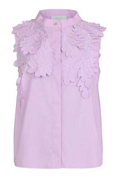Lilac sleeveless blouse with a band collar and concealed buttons, featuring intricate tonal floral embroidery layered across the shoulders and upper front.