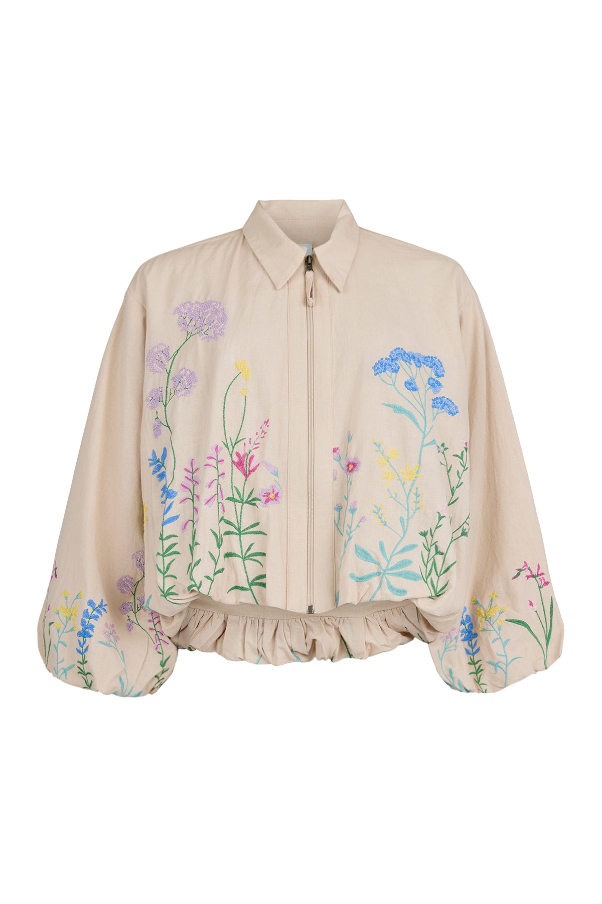 Beige cropped jacket with front zipper, featuring colorful embroidered wildflowers across the front and sleeves, with a gathered hem and voluminous long sleeves.