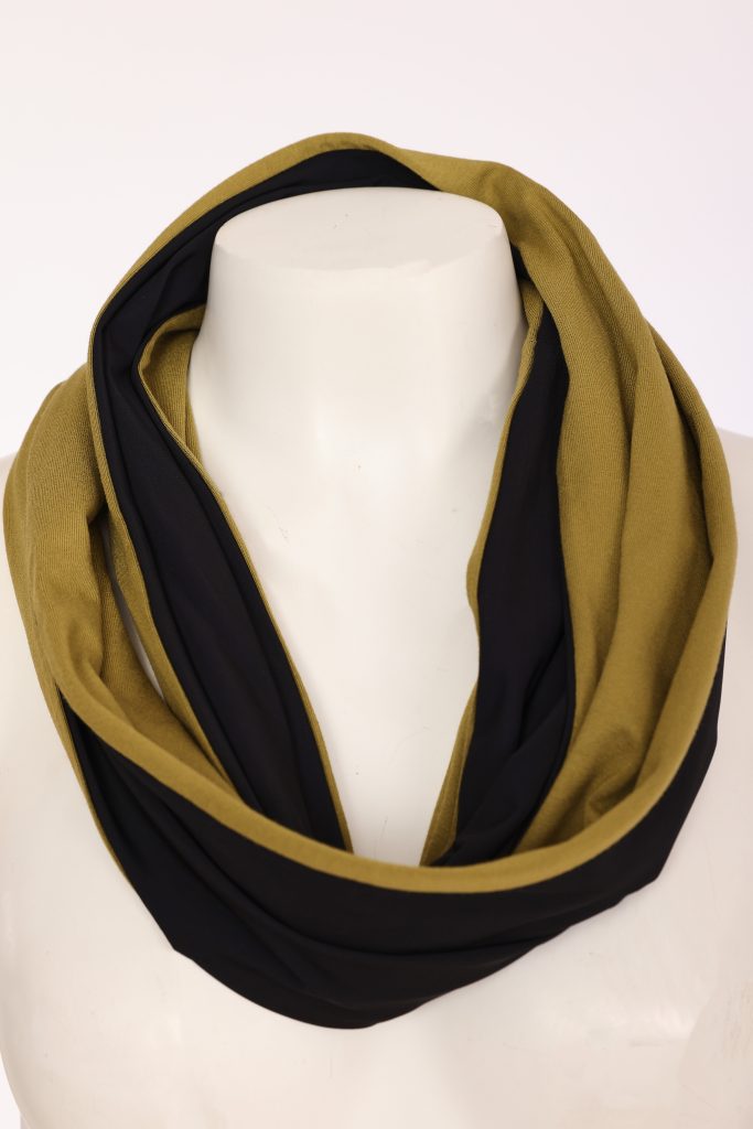 A double-layered infinity scarf in black and olive green, displayed on a white mannequin torso against a plain white background.