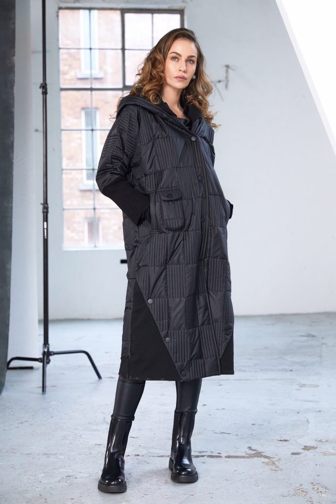Woman wearing a black quilted coat 