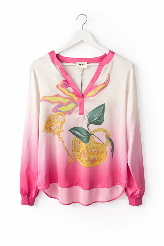 Gradient pink to white blouse with floral design on a hanger