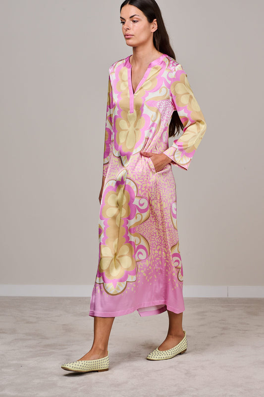 Pink and Yellow floral printed Midi dress with long sleeves V-neckline and pockets, styled with flat shoes on Model