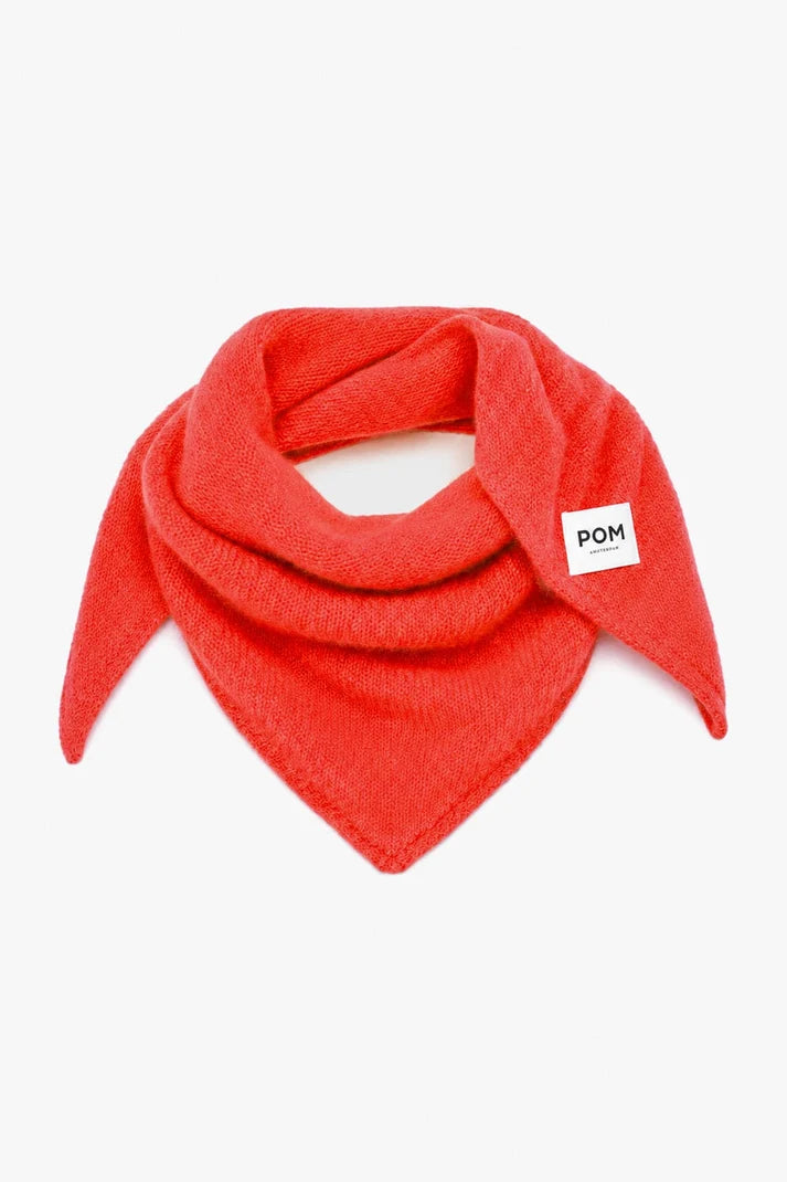 A bright red knit bandana or scarf with a small white square label reading 'POM' on the side, displayed on a clean white background.